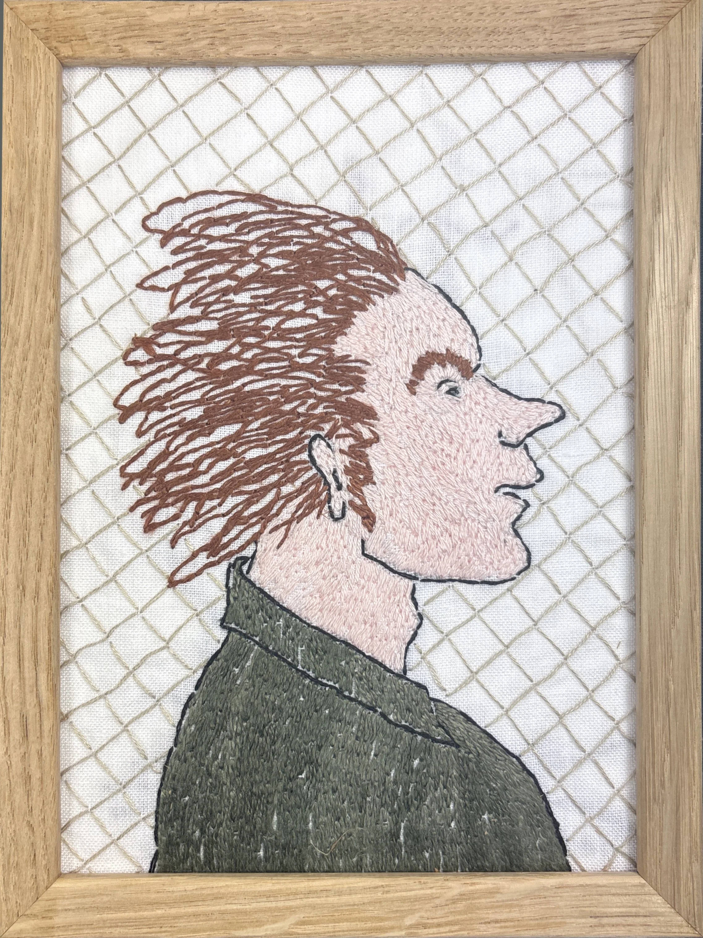 "Portrett mann 1", broderi på lin i treramme. 13x18cm, kr. 1800.