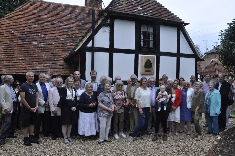 Trustees, residents, guests and villagers with the unveiled plaque.JPG