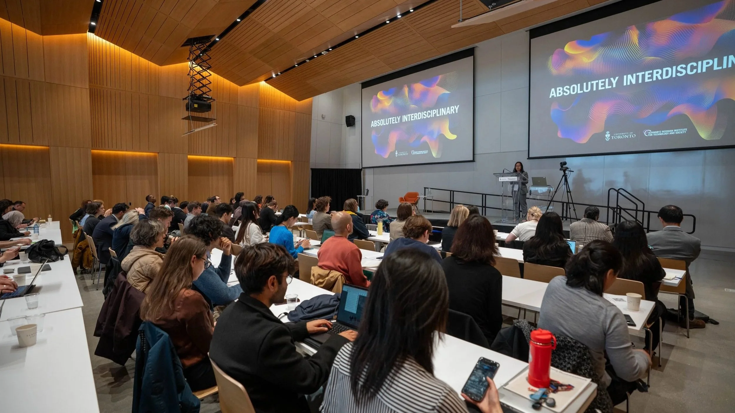 Photograph of participants listening to a speaker at Absolutely Interdisciplinary 2025.