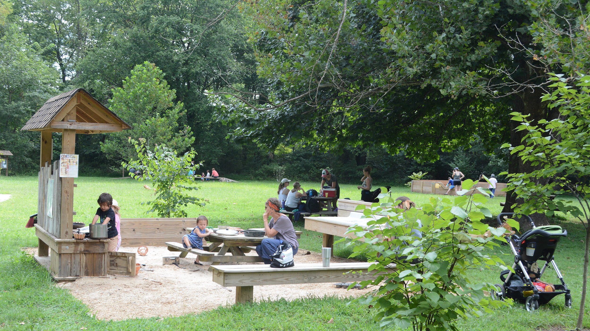 The mud kitchen was thoughtfully put near picnic tables under a shade tree.