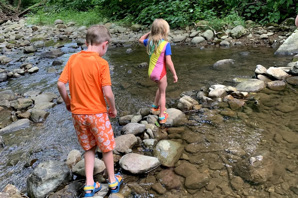 stoney creek park kid in creek.jpeg
