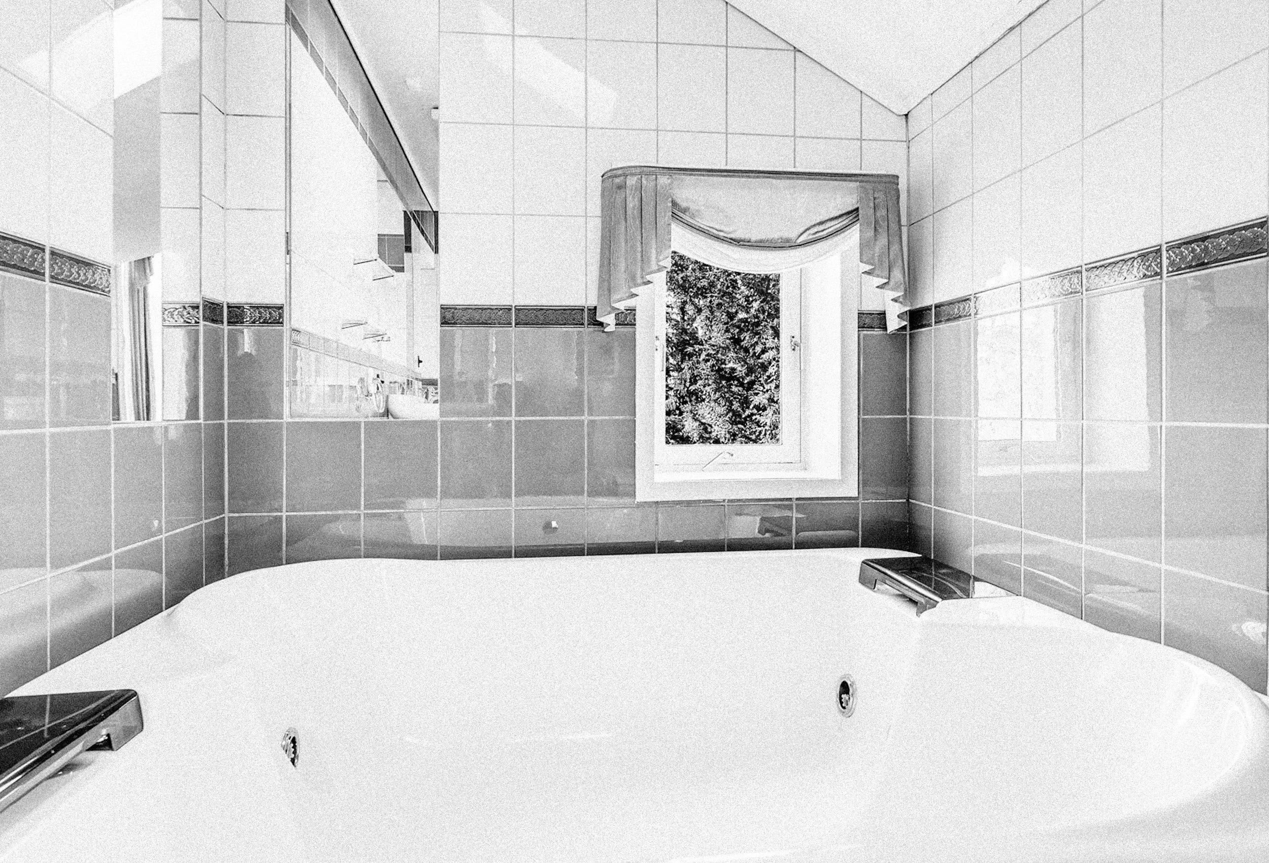 Svart hvitt foto av Geitmyrsveien før renovering