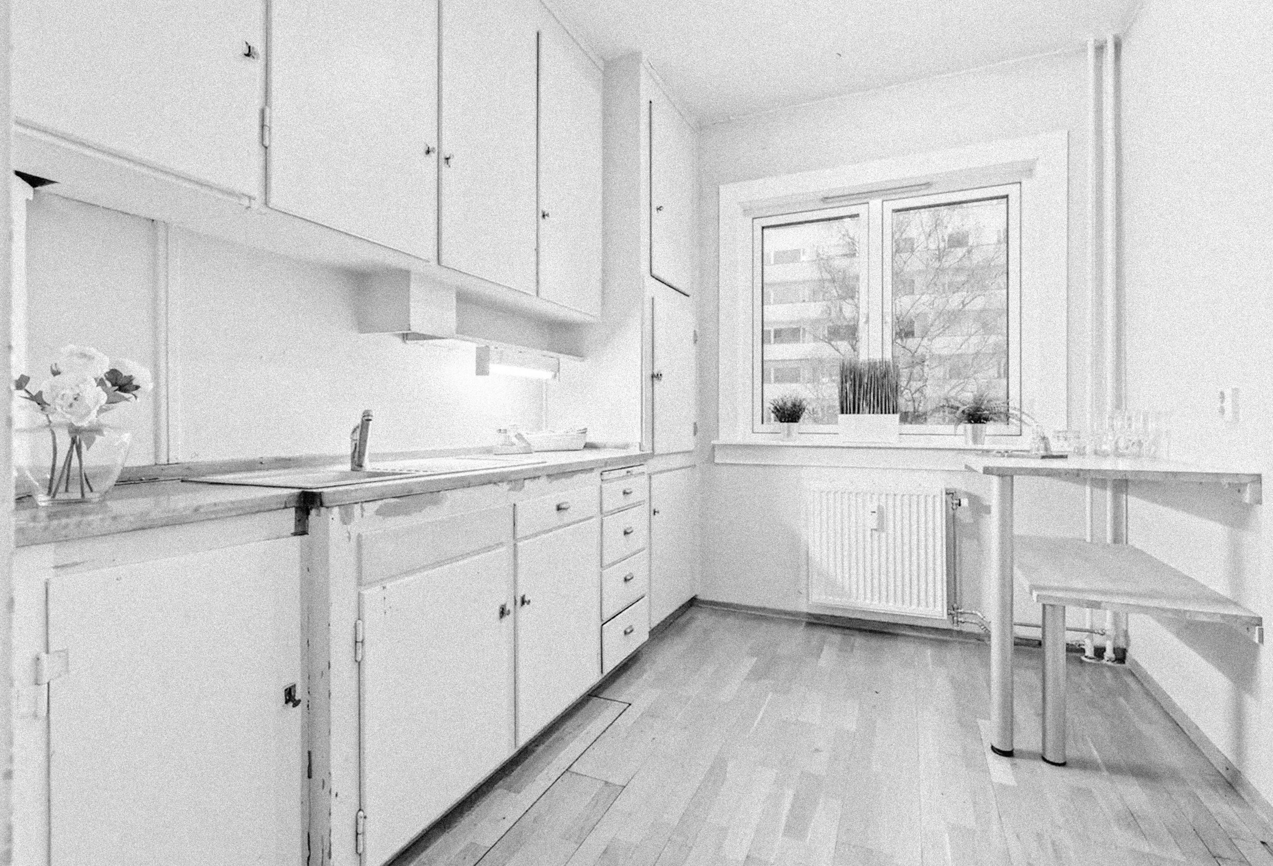 Svart hvitt foto av Harald Hårfagres gate før renovering