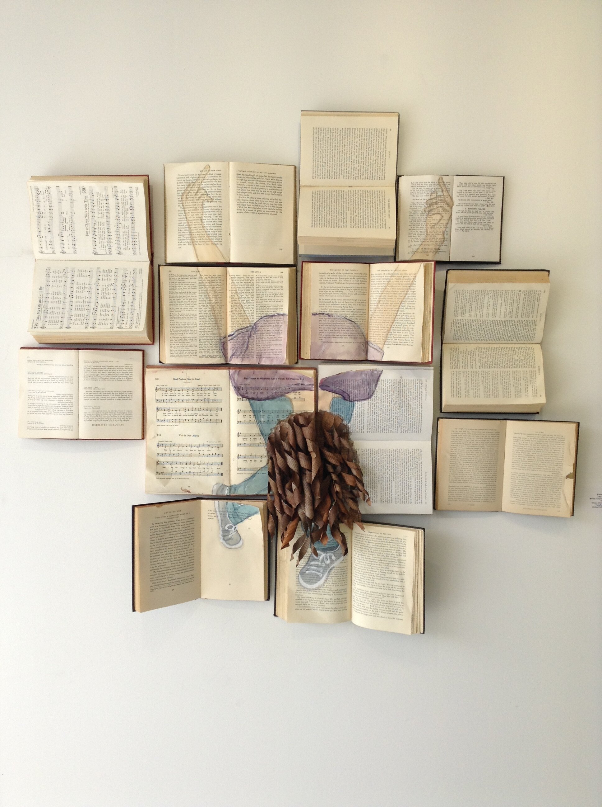 Unapologetic - Acrylic, graphite, and book pages on books. 