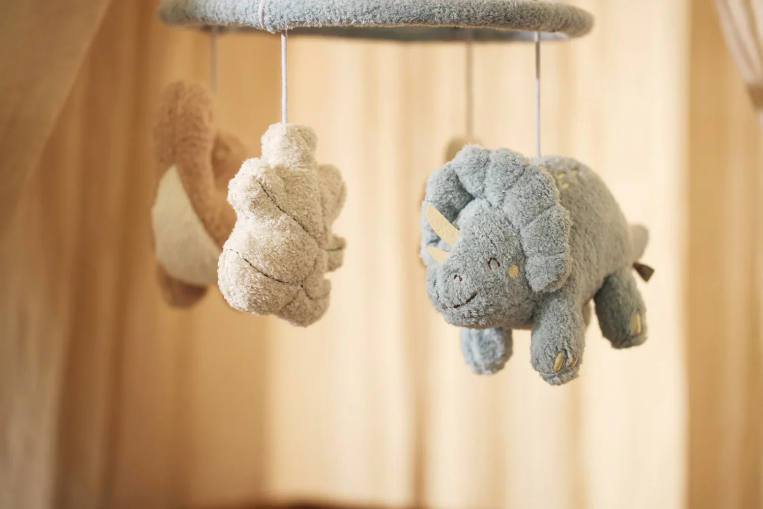 Móvil musical dinos