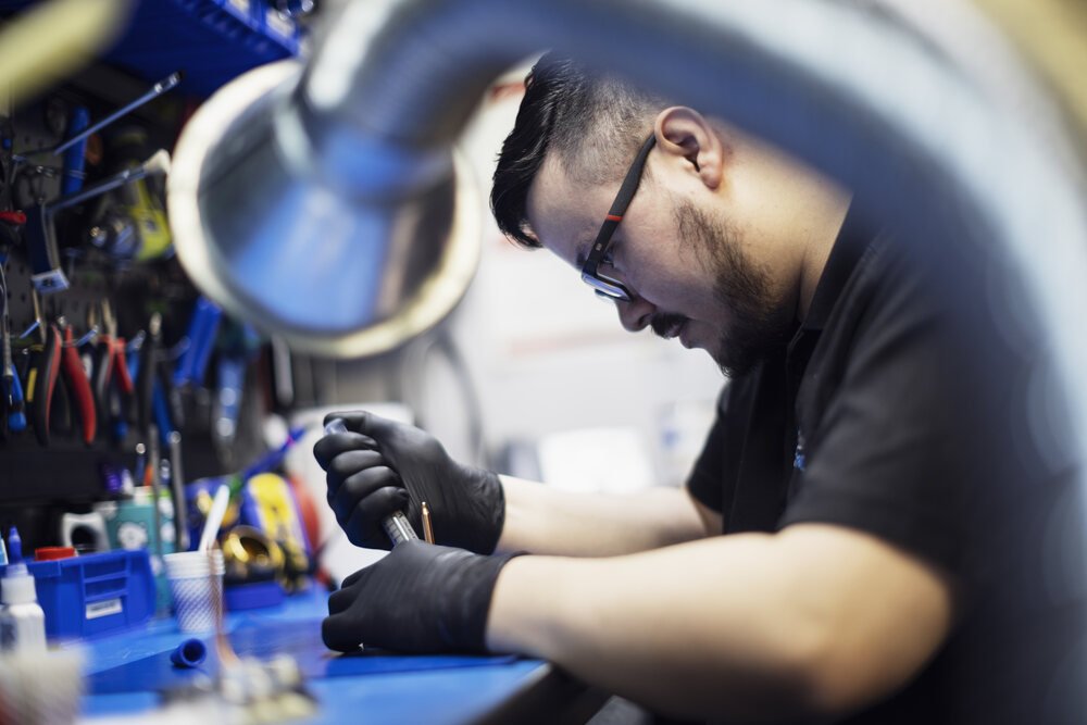 subsea production technician working on a camera