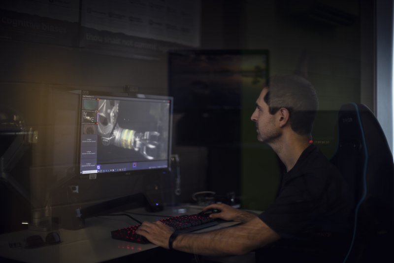 Man at desktop computer using SubC Imaging software