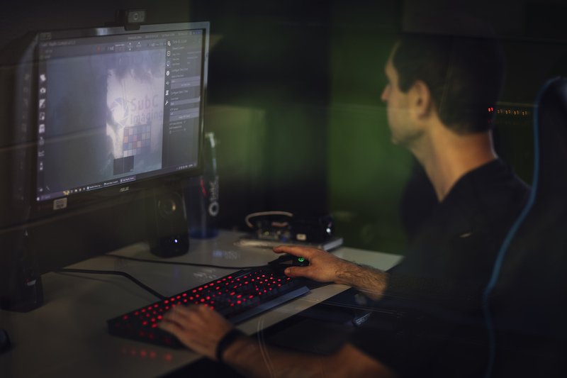 Man at computer using SubC Imaging Rayfin SCI