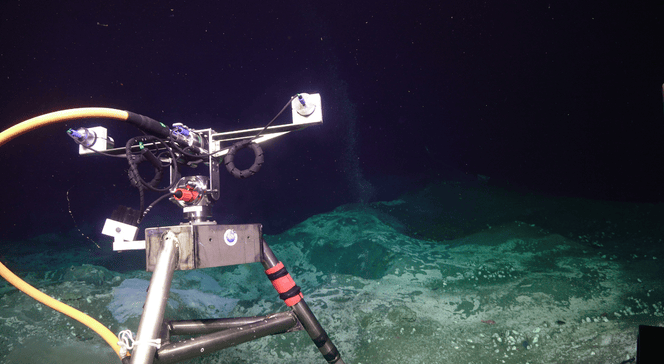 Underwater camera and mount pointed at underwater volcano