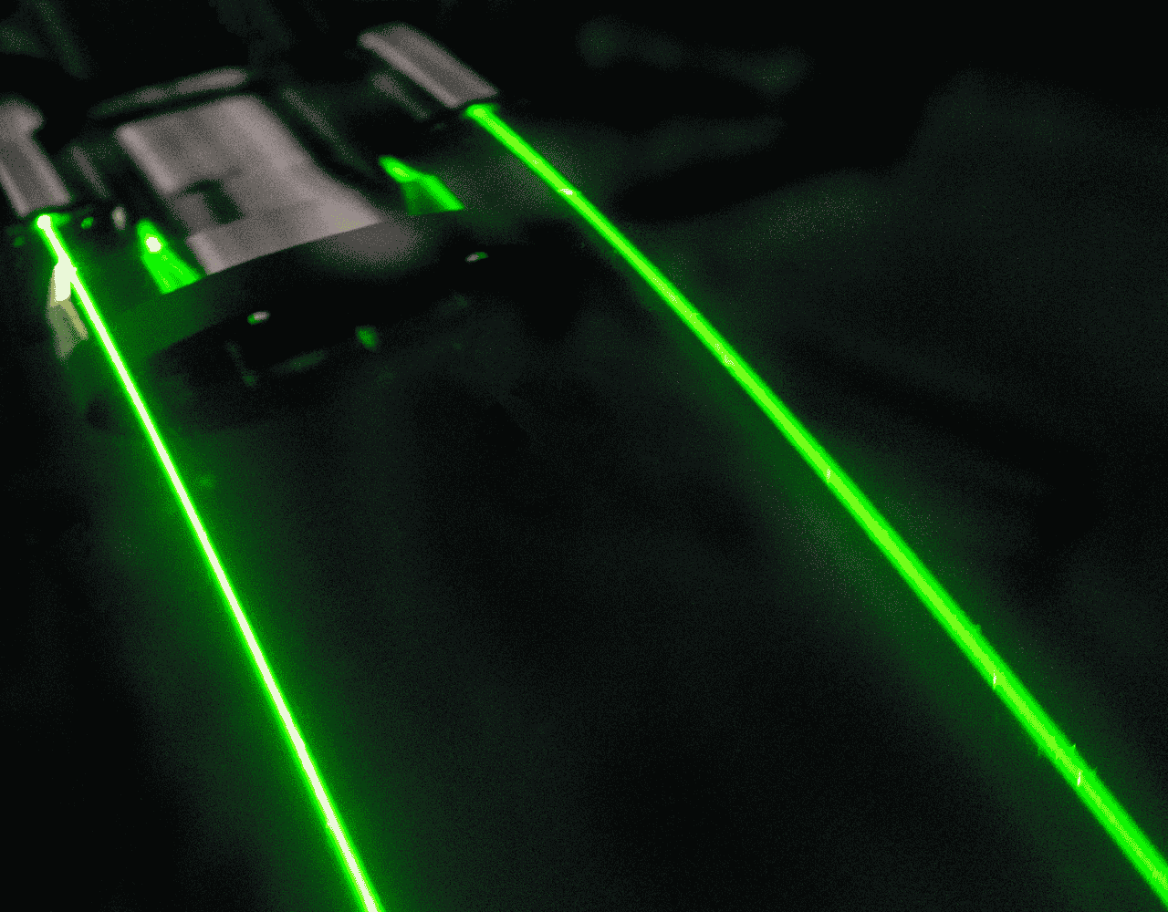 SubC’s MantaRay Parallel Lasers projecting two bright green laser lines in parallel, mounted on a camera system.