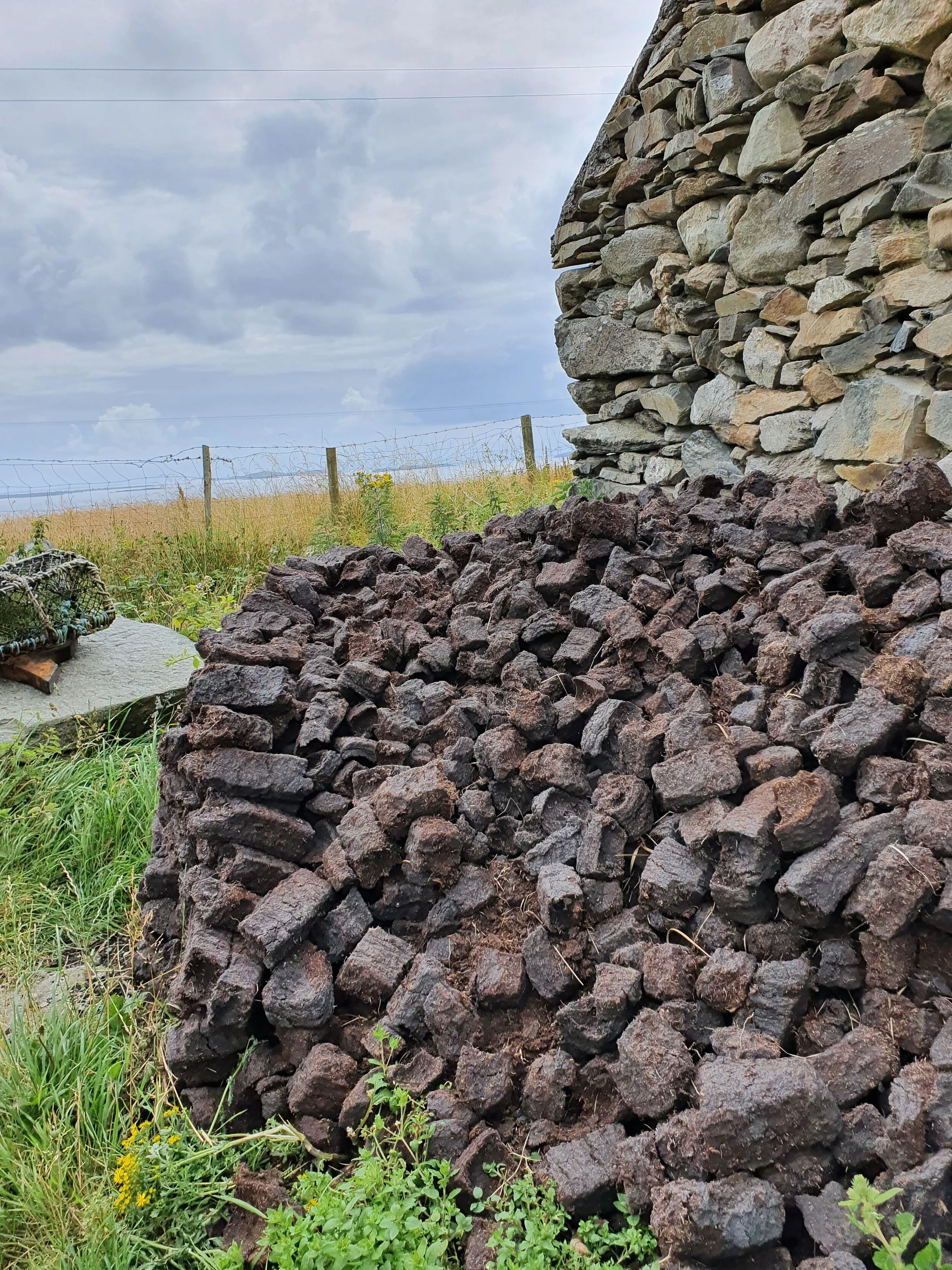 A mound of cut turf on Inishbofin Island, County Galway, Ireland