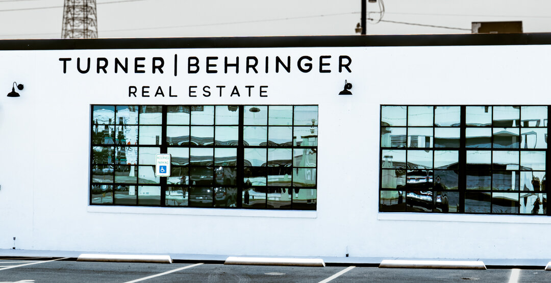 Hand painted sign for Turner-Behringer real estate in Waco, TX 