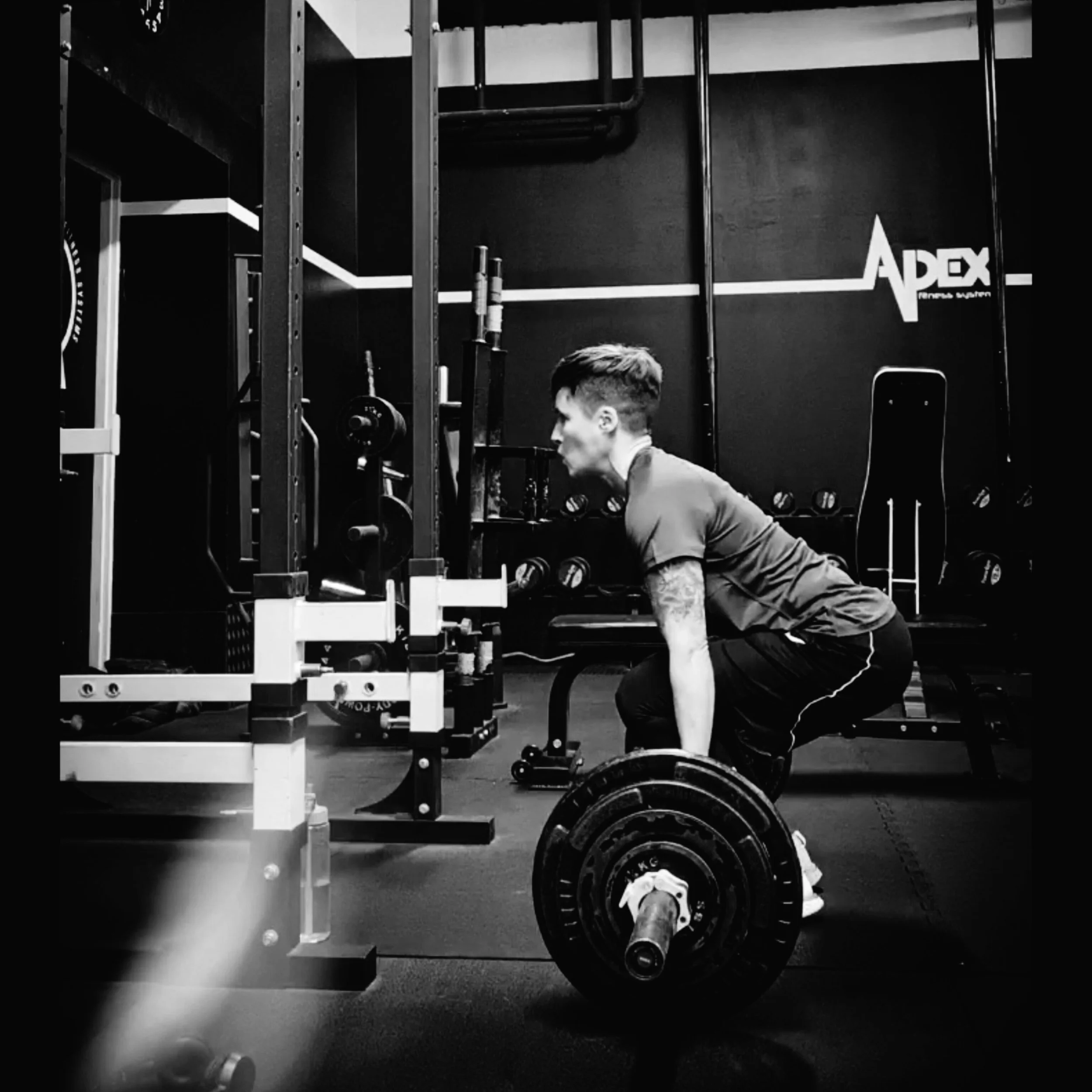Photo of Mel doing a barbell deadlift