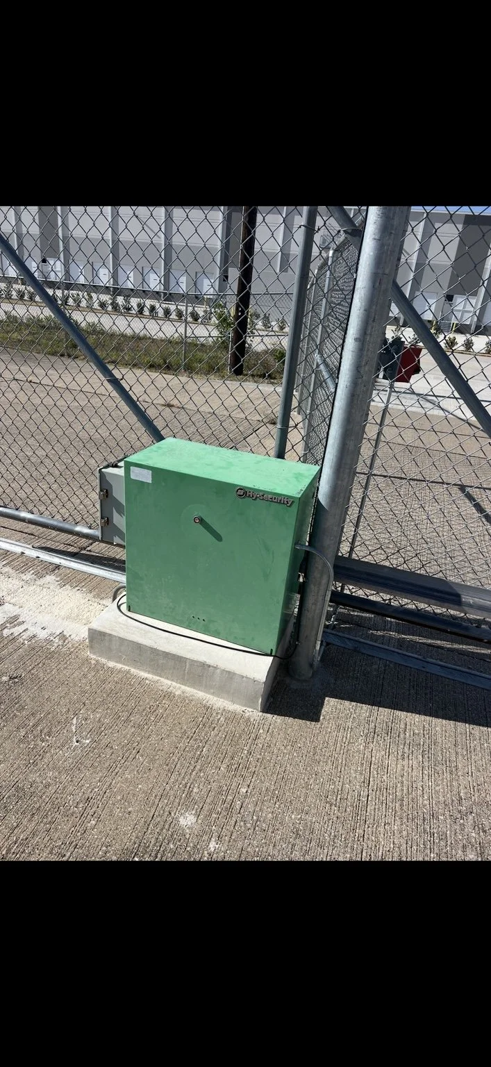 BEFORE — Mesquite Airport, Texas. Existing HySecurity operator on a chain-link sliding gate.