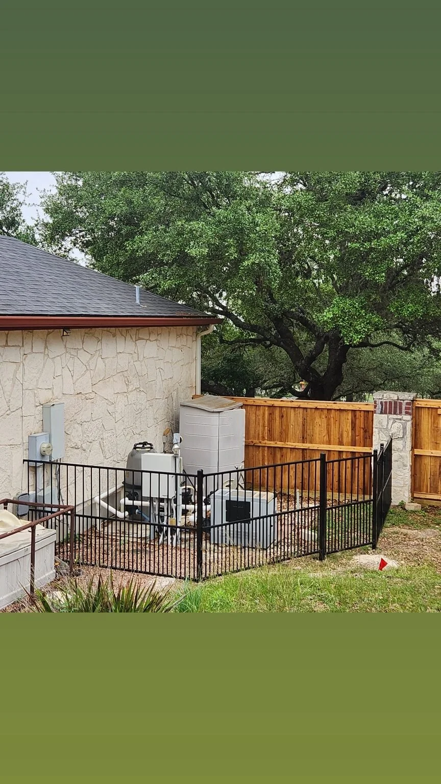 Cedar and wrought-iron fence project in Boerne, Texas