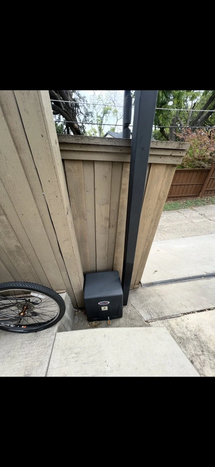 BEFORE — Lake Highlands, Dallas. Existing All-O-Matic operator on a wood sliding gate.
