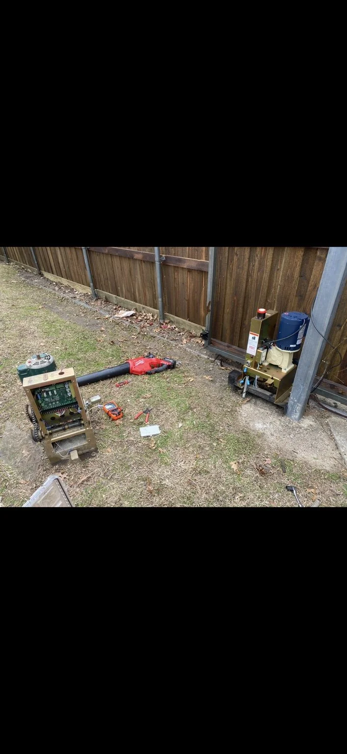 INSTALLATION IN PROGRESS — Carrollton, Texas. New Ramset operator with the blue motor mounted beside the gate; the removed unit is on the left. Duncan’s Services repairs and replaces Ramset operators.