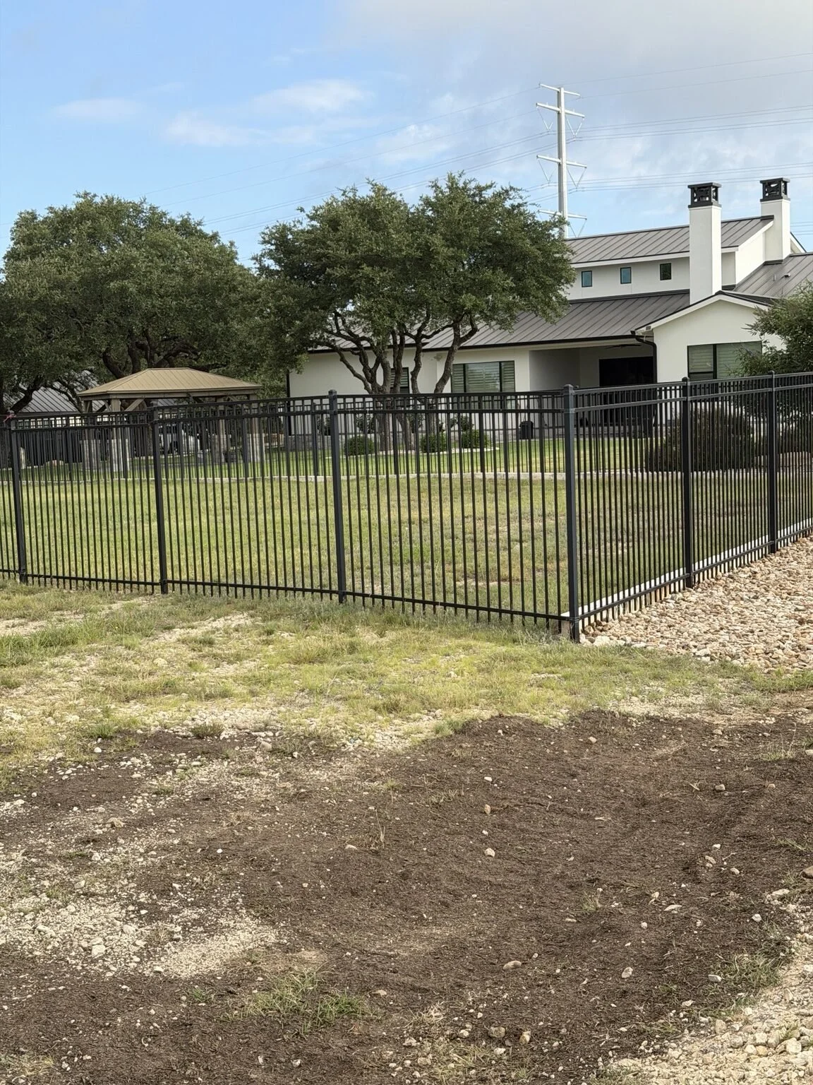 Wrought-iron fence installation in Spring Branch, Texas