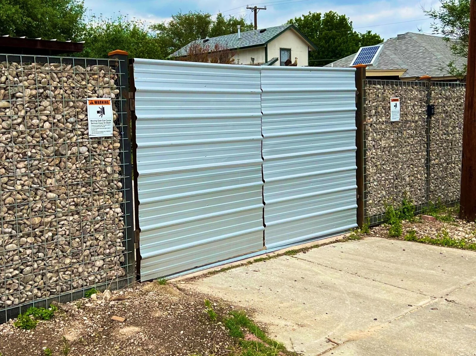 Double Automatic Steel Gate on an Iron Gabion Fence, San Antonio Texas