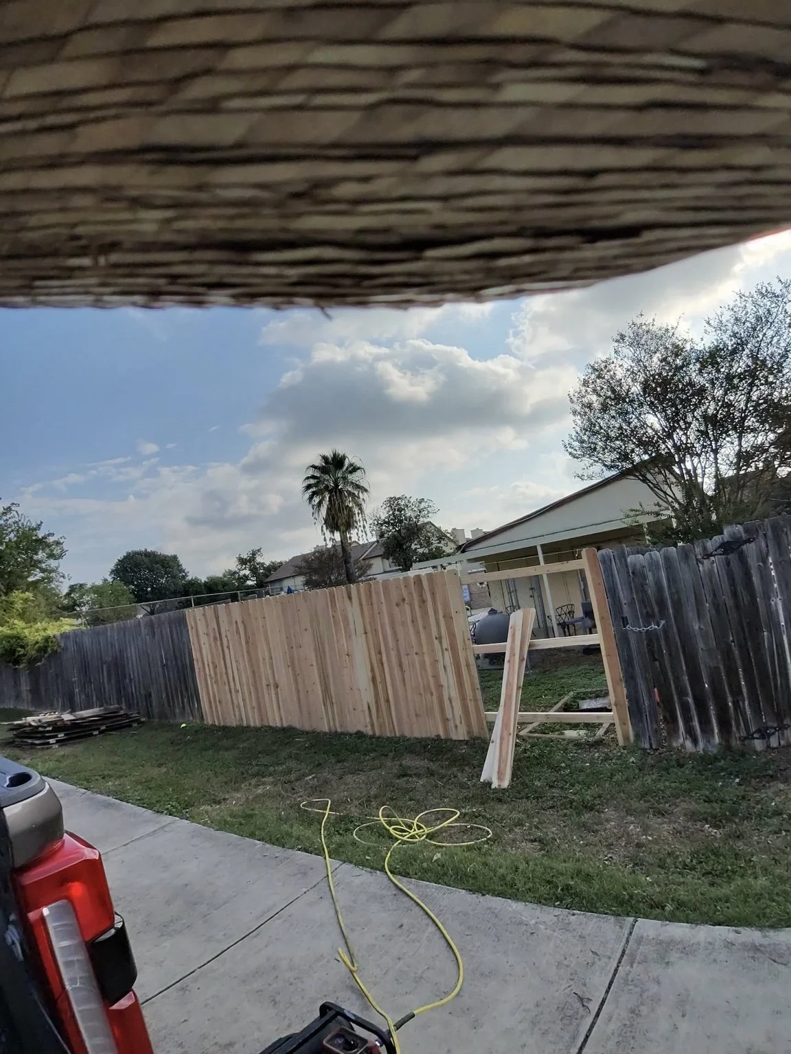 In progress: Replacing damaged pickets and horizontal rails with new cedar lumber.
