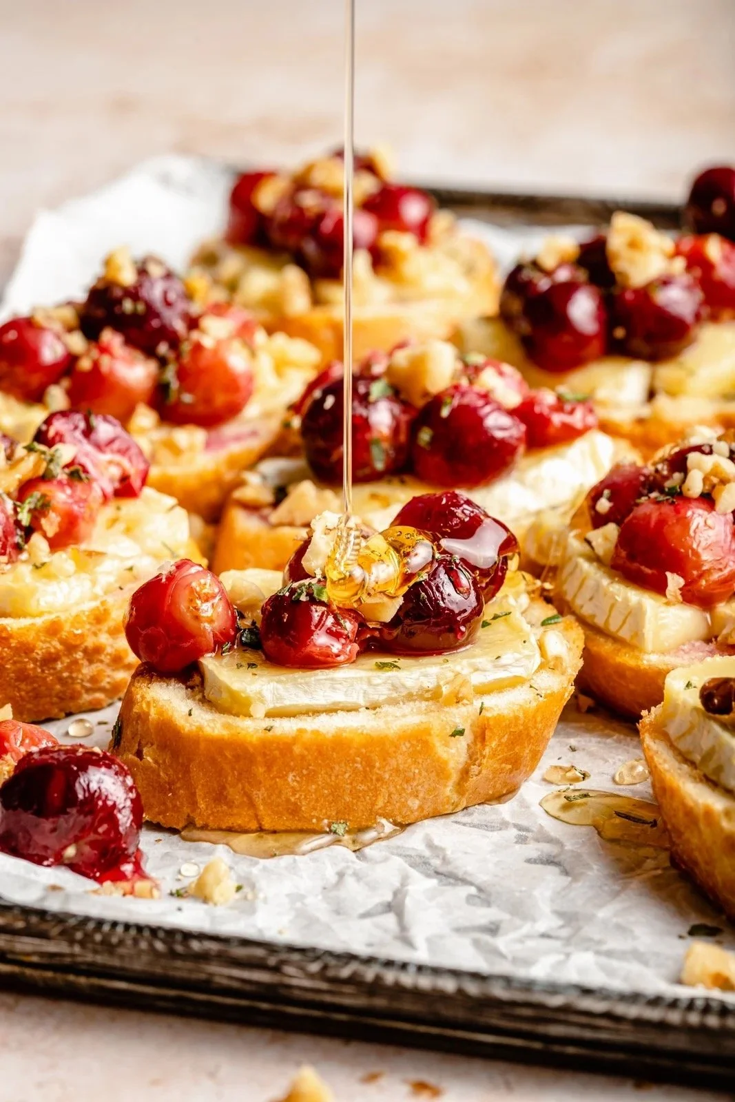 Grape, Walnut, and Labneh Crostini with Chilli Honey