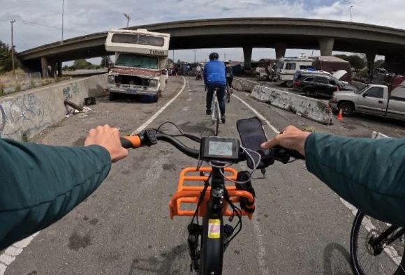 View from a cyclist's perspective while riding on a roadway.