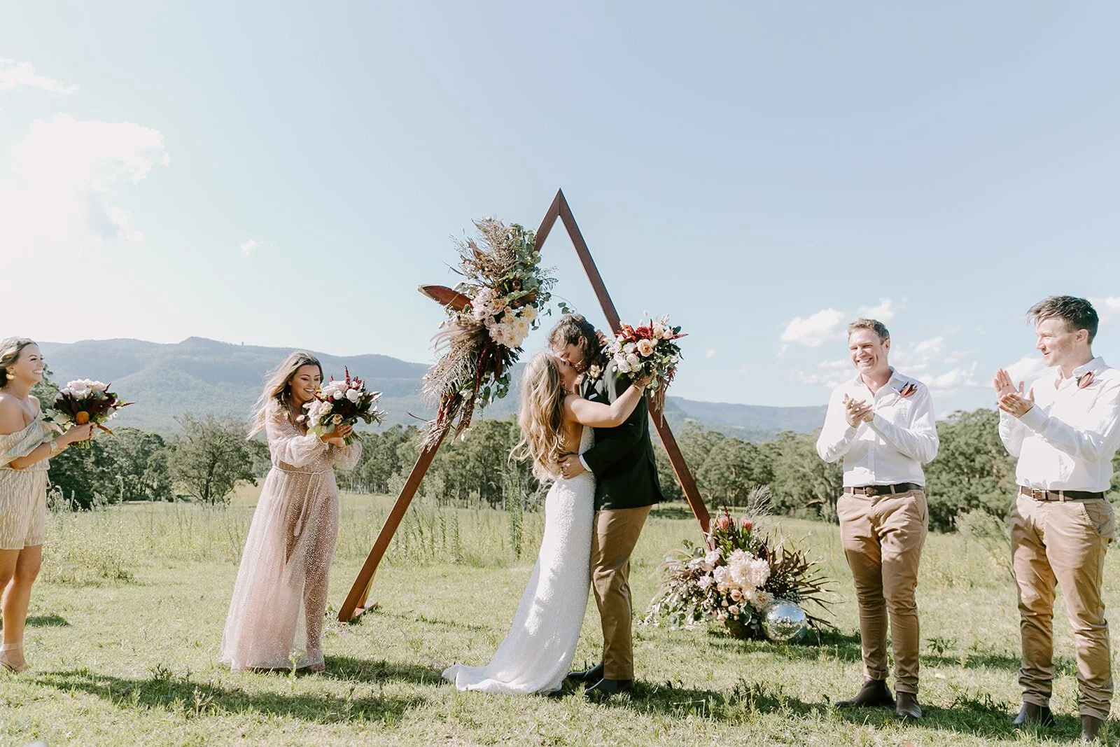 Triangular timber arbour available for hire in Sydney and NSW, ideal for rustic and boho wedding ceremonies and bridal entrances.