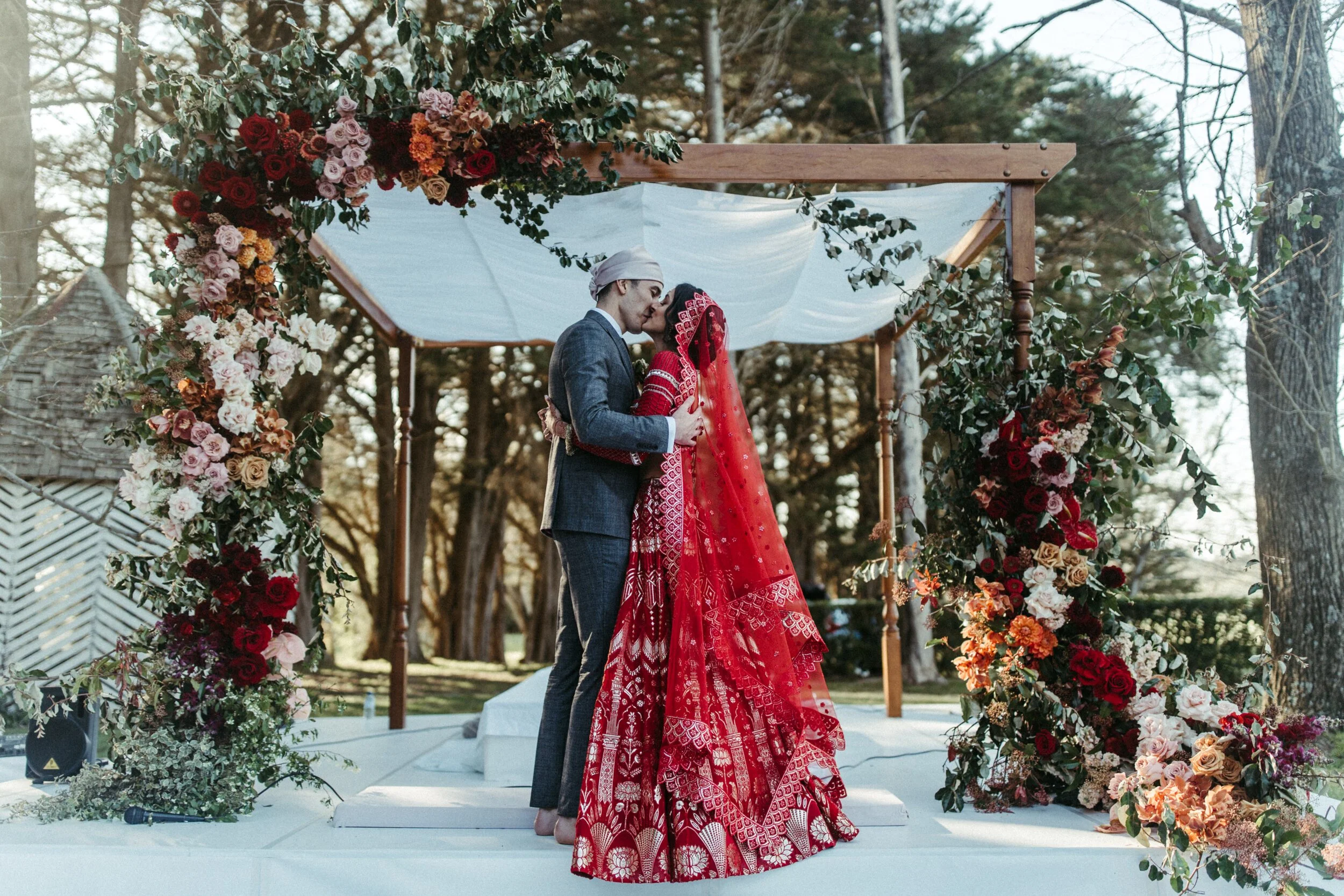 Hand-carved wooden mandap with turned timber legs available for hire in Sydney and NSW, ideal for Hindu, Jewish, and traditional wedding ceremonies.