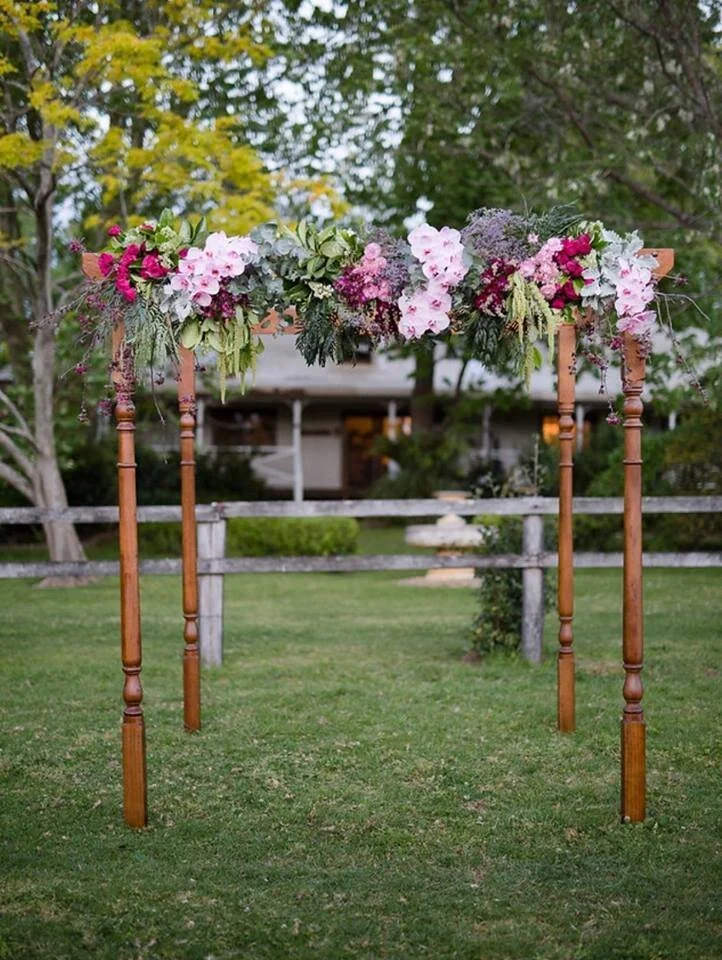 Hand-carved wooden mandap with turned timber legs available for hire in Sydney and NSW, ideal for Hindu, Jewish, and traditional wedding ceremonies.