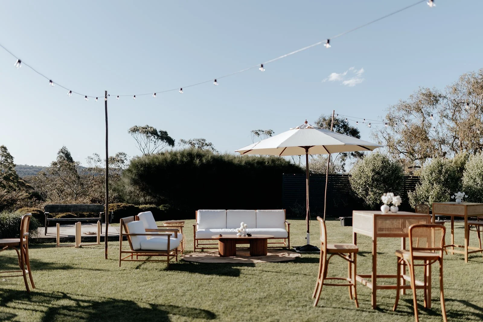 Beige umbrella canopy with wooden leg available for hire in Sydney and NSW, ideal for outdoor events and weddings.