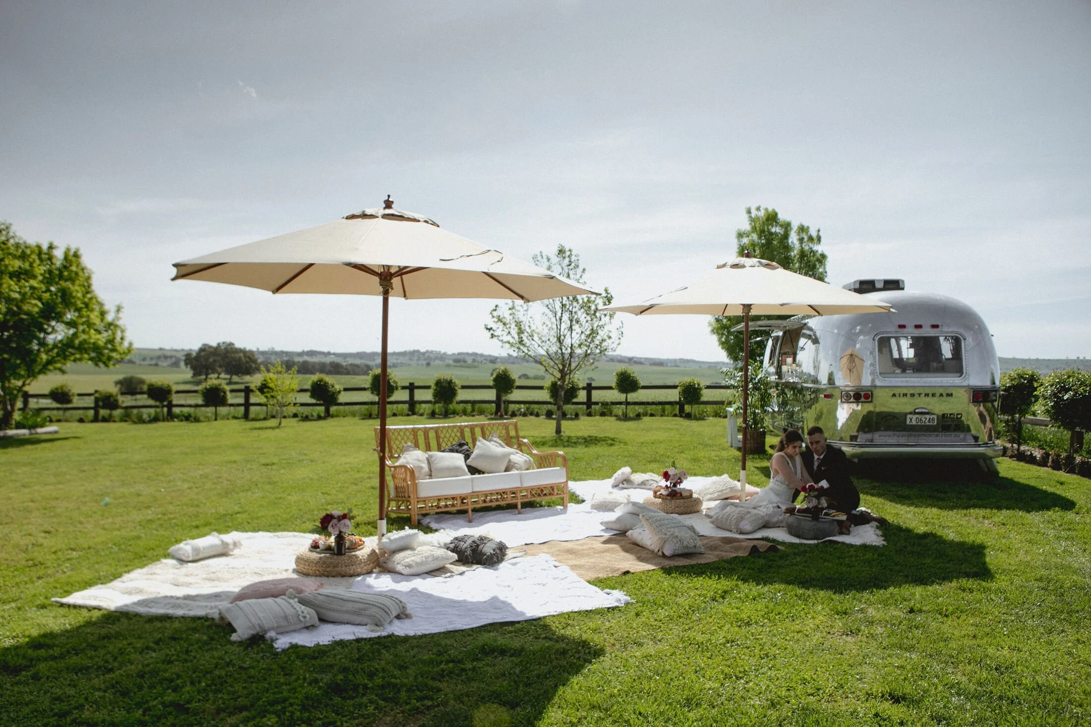 Beige umbrella canopy with wooden leg available for hire in Sydney and NSW, ideal for outdoor events and weddings.