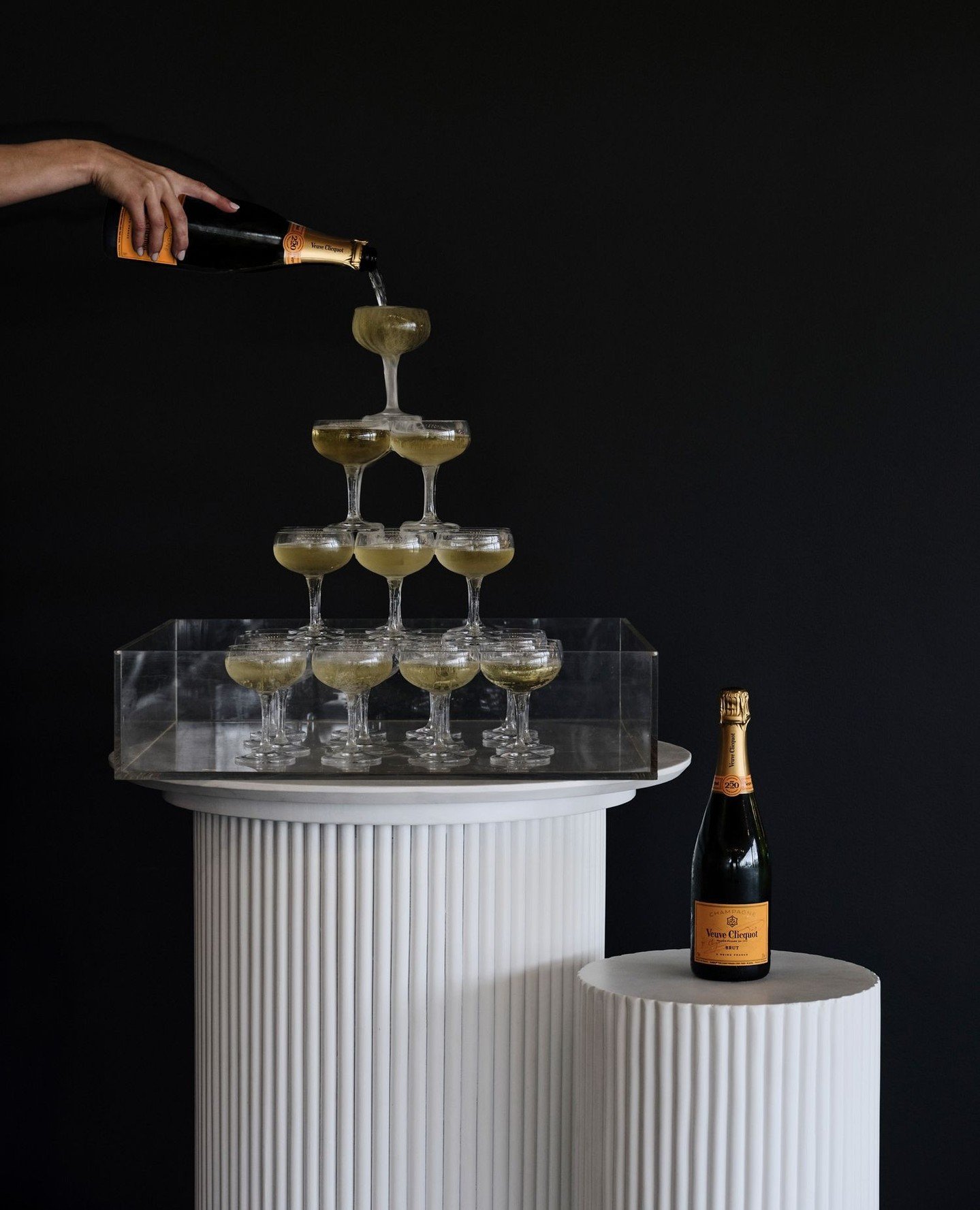 The silly season is officially here, and there&rsquo;s no better way to celebrate than with bubbles on our Ribbed Bar Table and Plinths. ⁠
⁠
A little sparkle, a little structure, and a whole lot of style ✨️⁠
⁠
#HYREEvents #SillySeason #SydneyEvents #