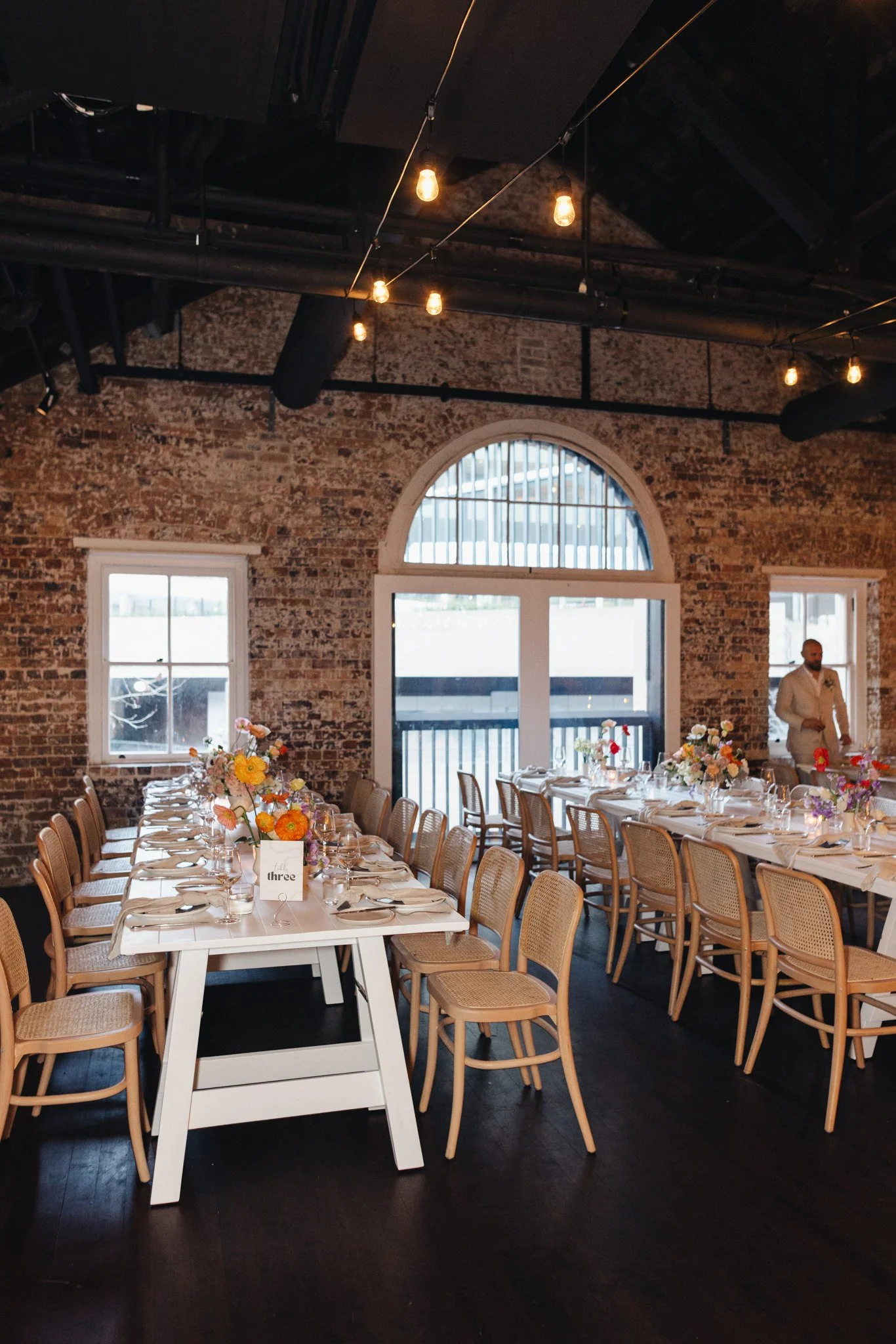 White paneled timber dining tables available for hire in Sydney and NSW, ideal for weddings, corporate dinners, and private events.