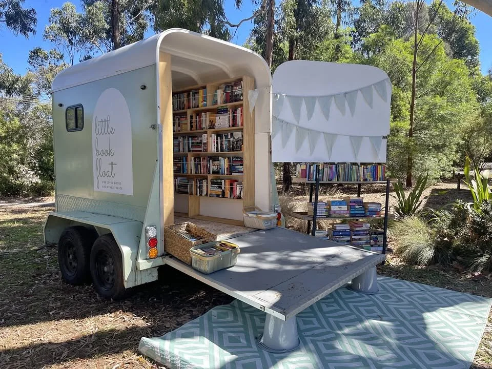 Tiny bookshop on wheels, a vintage horse float convered into a book shop.