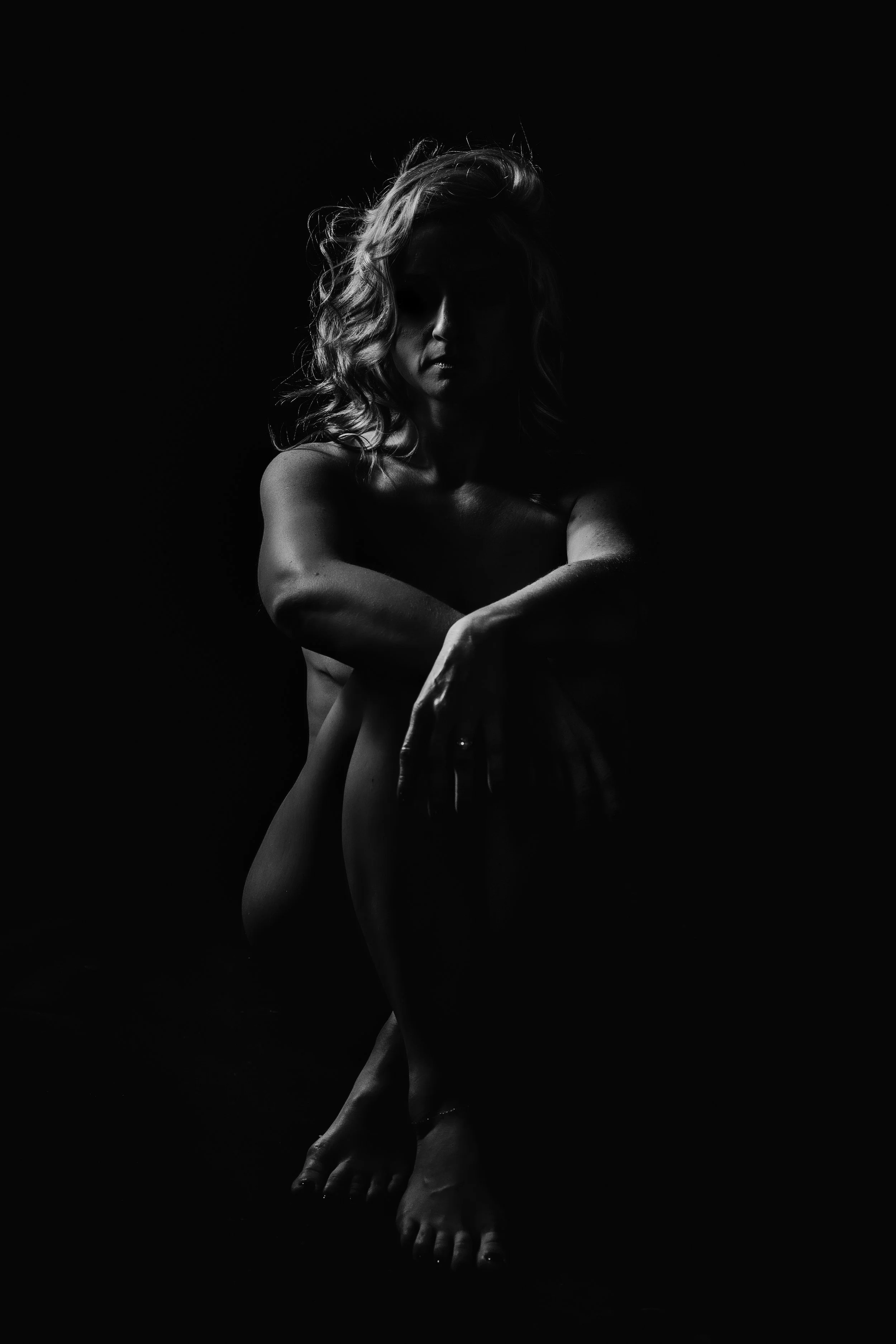 Moody boudoir photography session in Princeton, MN studio. Intimate, confident, and empowering experience by Sheri Hiller.