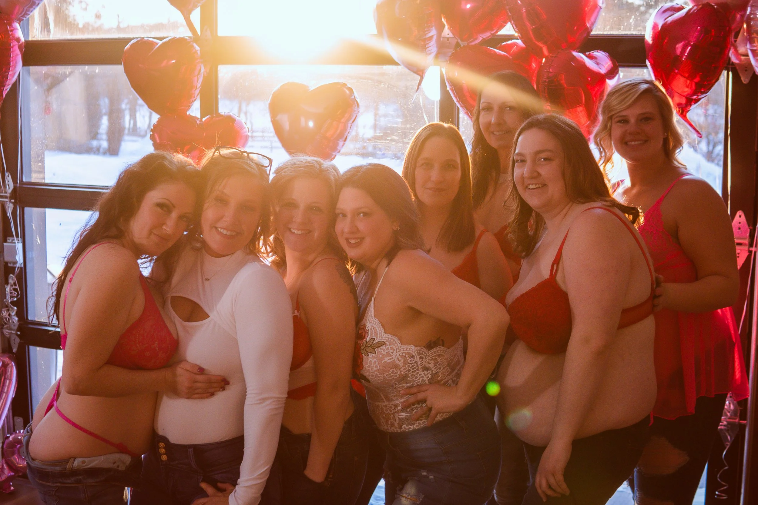 Empowerment photoshoot for women in Central Minnesota capturing self-love, laughter, and body confidence with photographer Sheri Hiller.