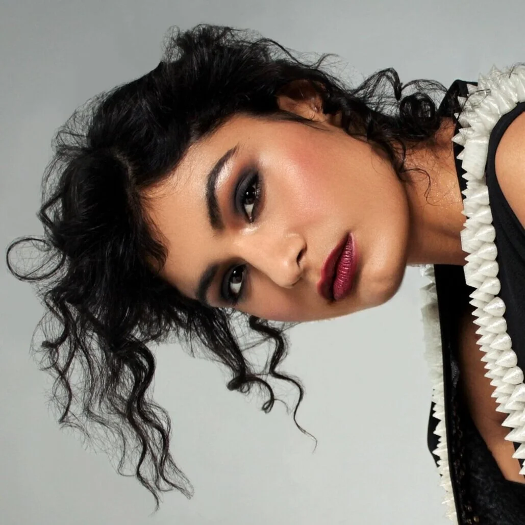 glam black smokey eye red lip brown eyes and dark skin makeup look