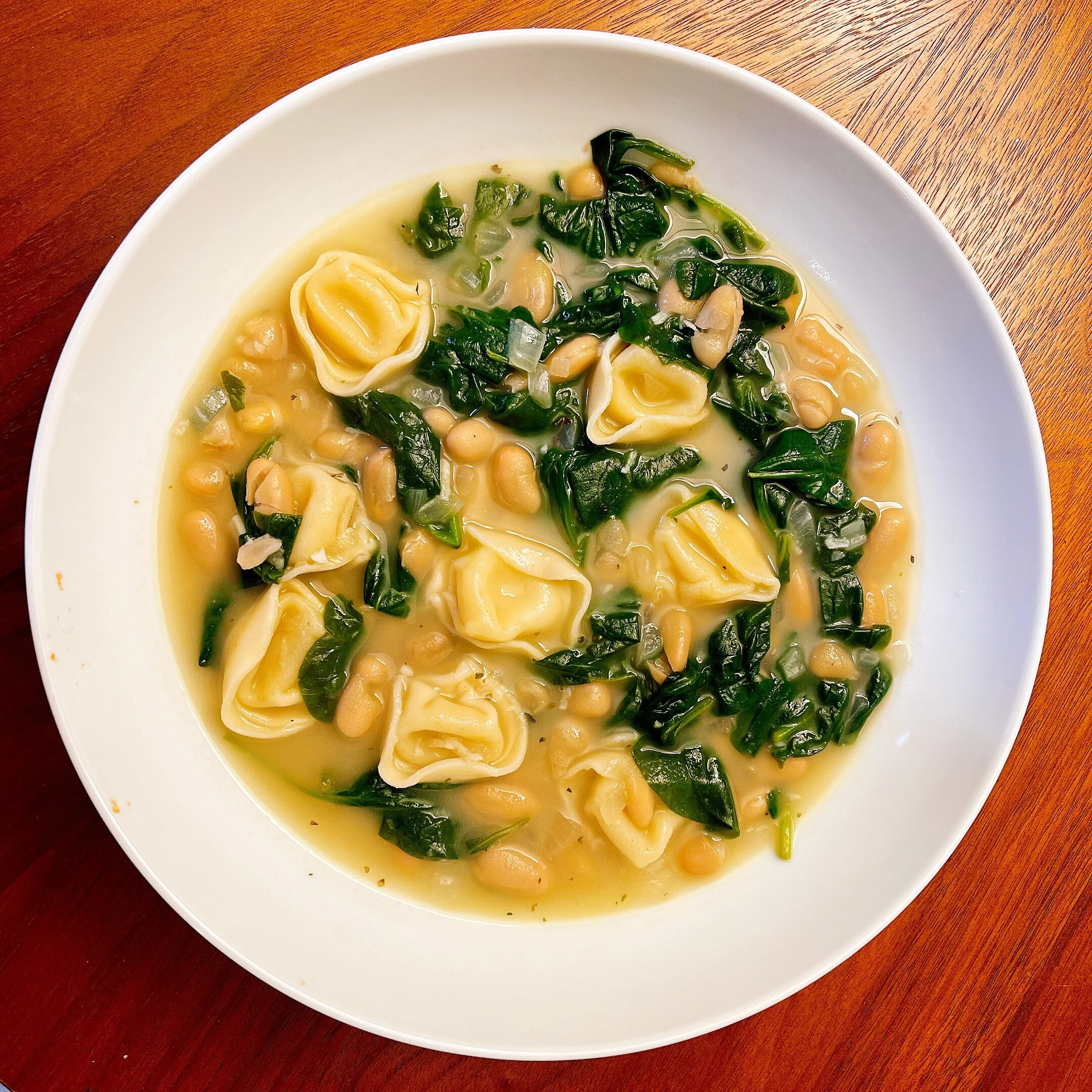 Tortellini En Brodo Meets Escarole and Beans