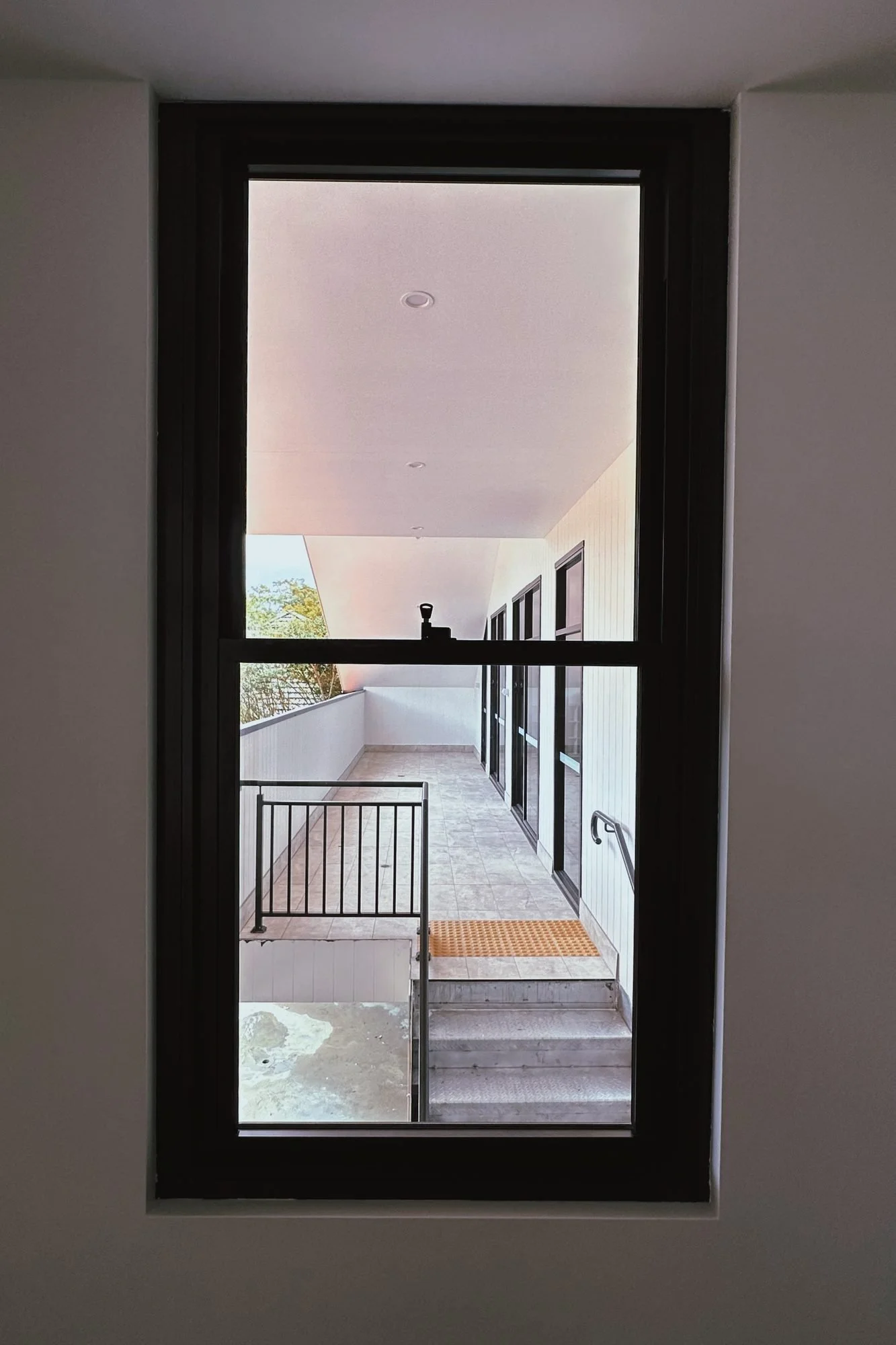 Wahroonga Childcare Centre, Sydney – view through upper-floor window – Archian Architects