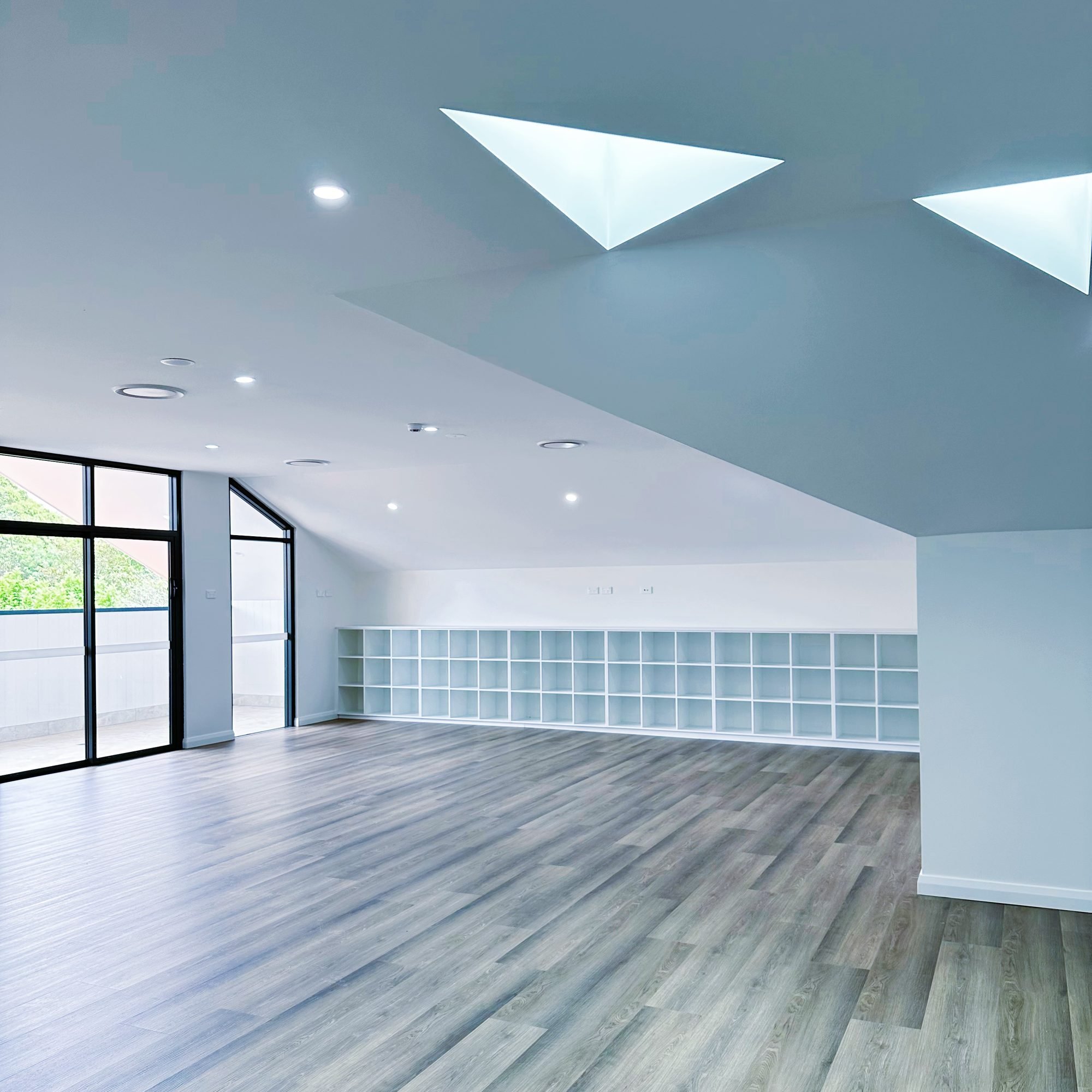 Wahroonga Childcare Centre, Sydney – playroom under triangular skylights – Archian Architects