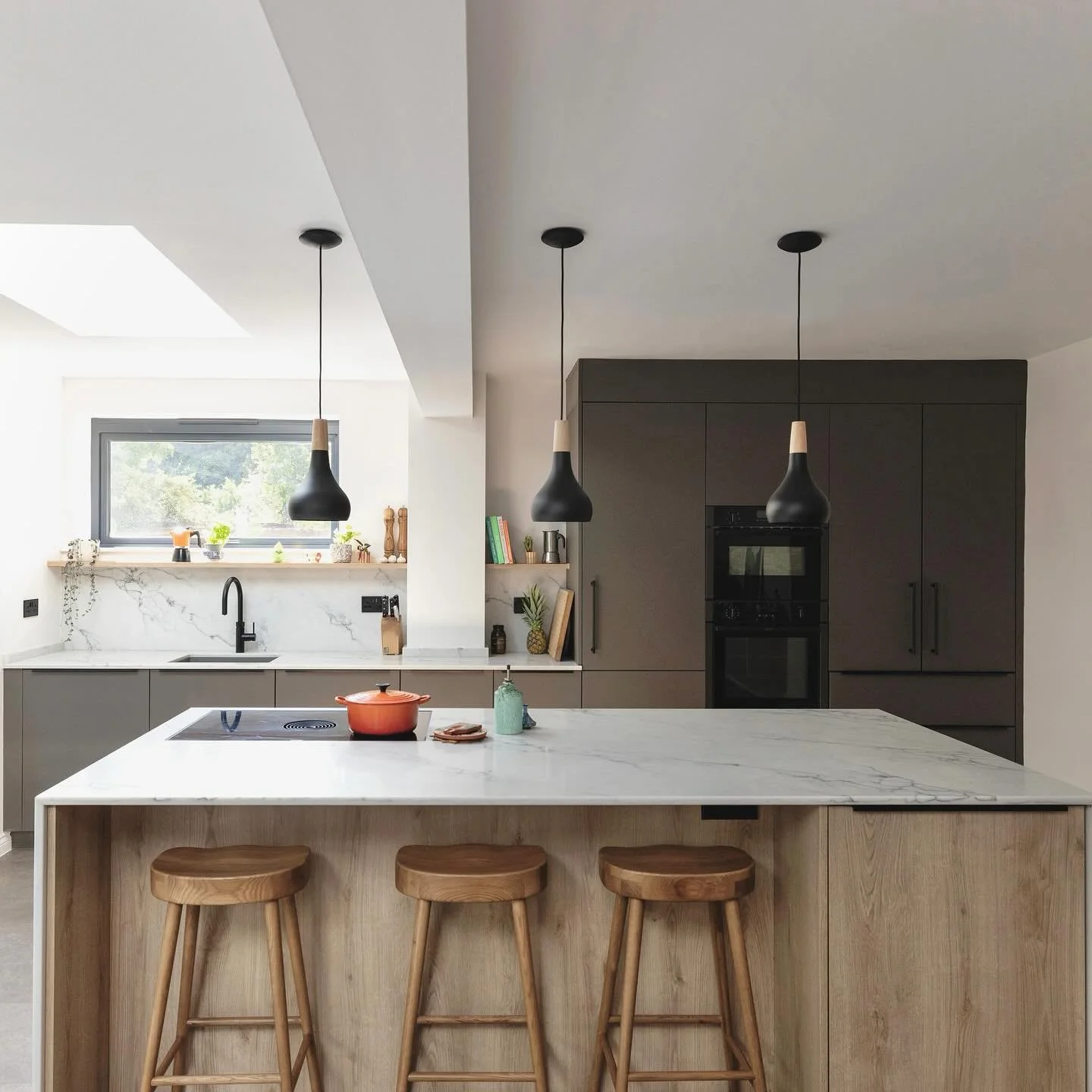 Clean lines, natural textures and effortless functionality - this modern kitchen blends Scandinavian simplicity with warm, earthy tones. 

Finished with a generous island for gathering, soft natural light, and subtle open shelving details - it&rsquo;