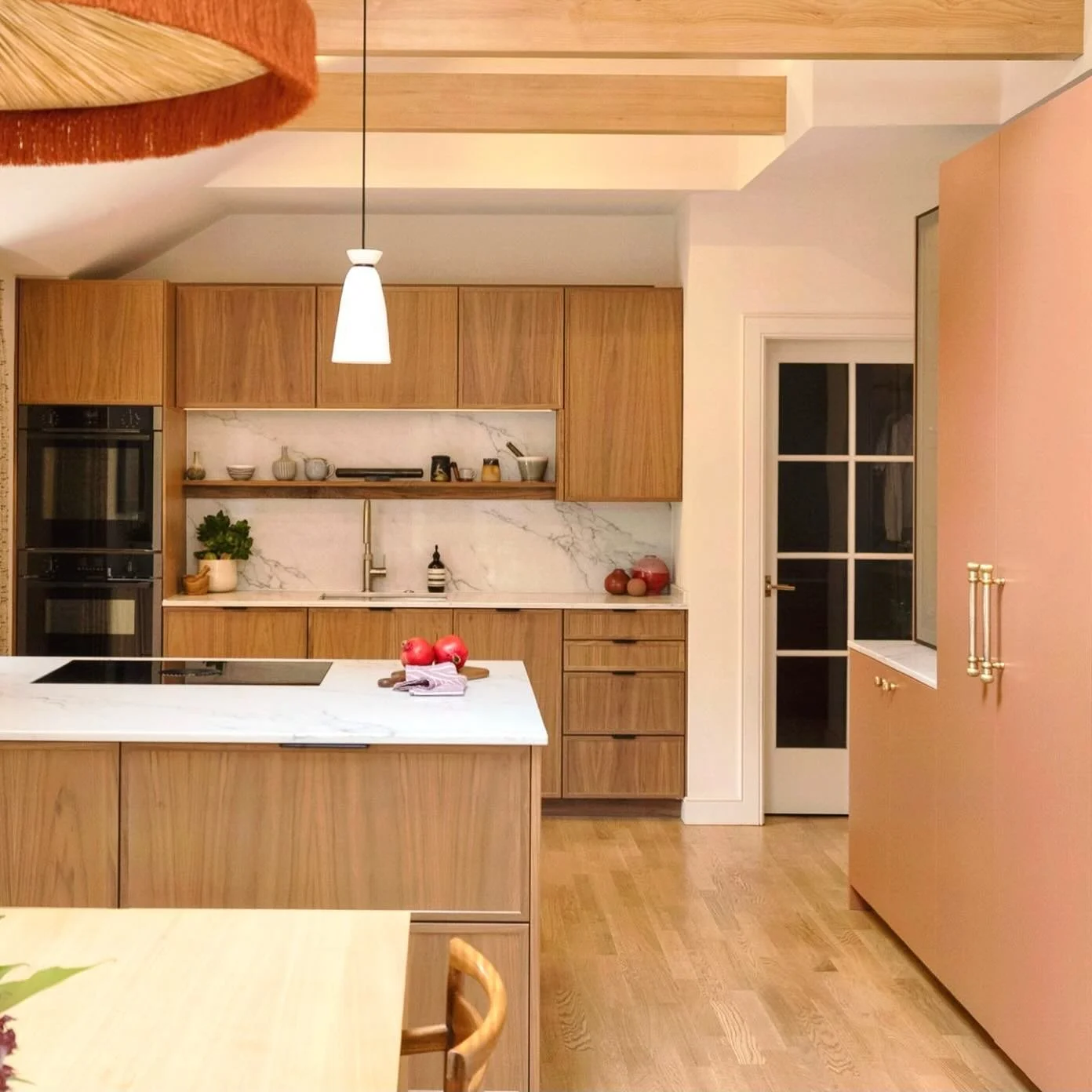Delighted to return and capture this stunning kitchen that showcases an elegant mix of materials and products - a bold design that truly makes a statement! 

Cabinetry: Bespoke walnut framed doors and dusky pink lacquered doors
Work surfaces: 20mm Mi