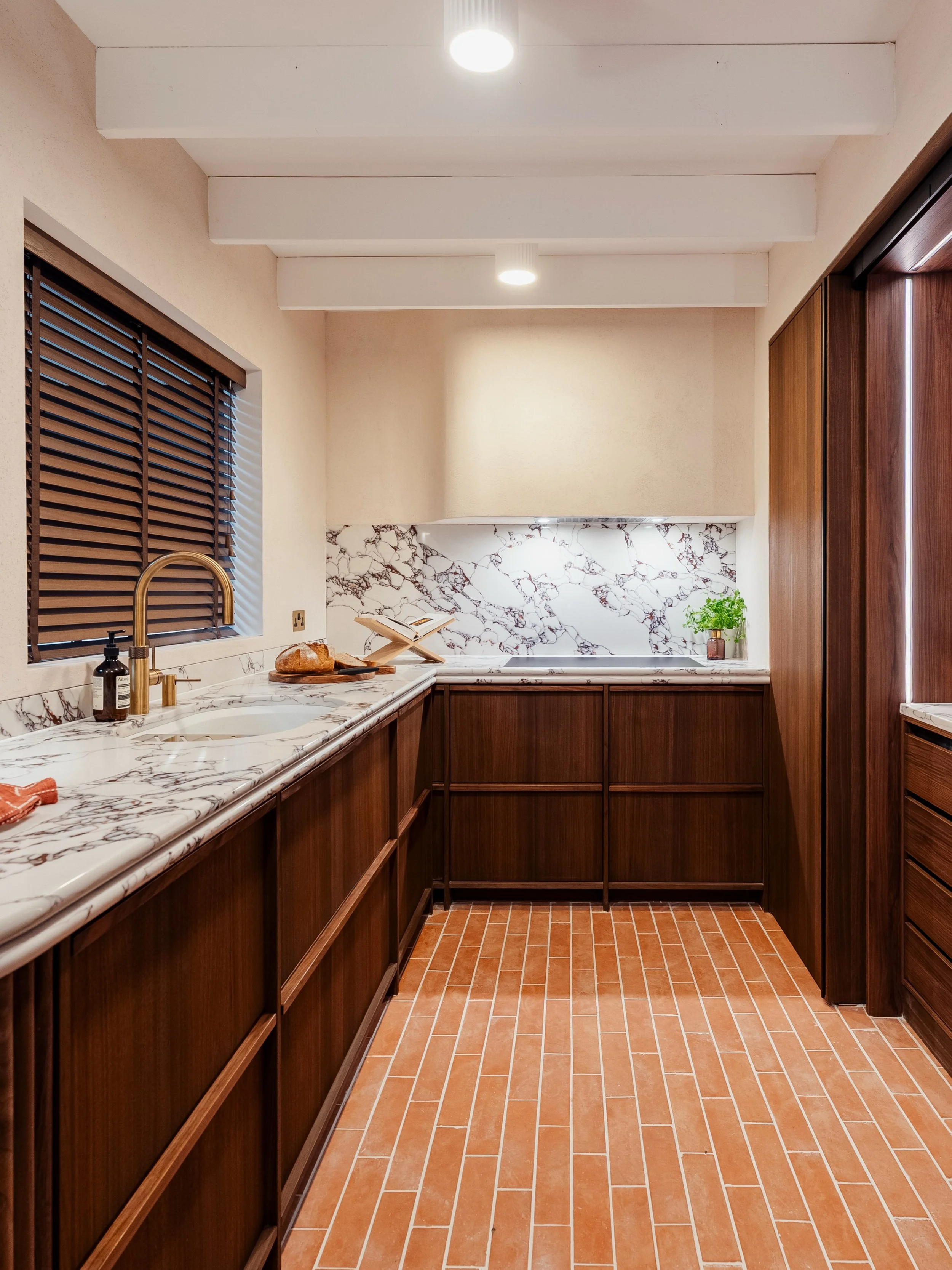 Japandi, through a Kitchens by Nick McNally lens.

Our latest display brings together the simplicity of Japanese design with the warmth and restraint of Scandinavian interiors.

Rich walnut cabinetry is layered with natural materials, soft integrated