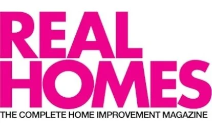 Logo of 'Real Homes', a home improvement magazine. Bold pink text on white background.