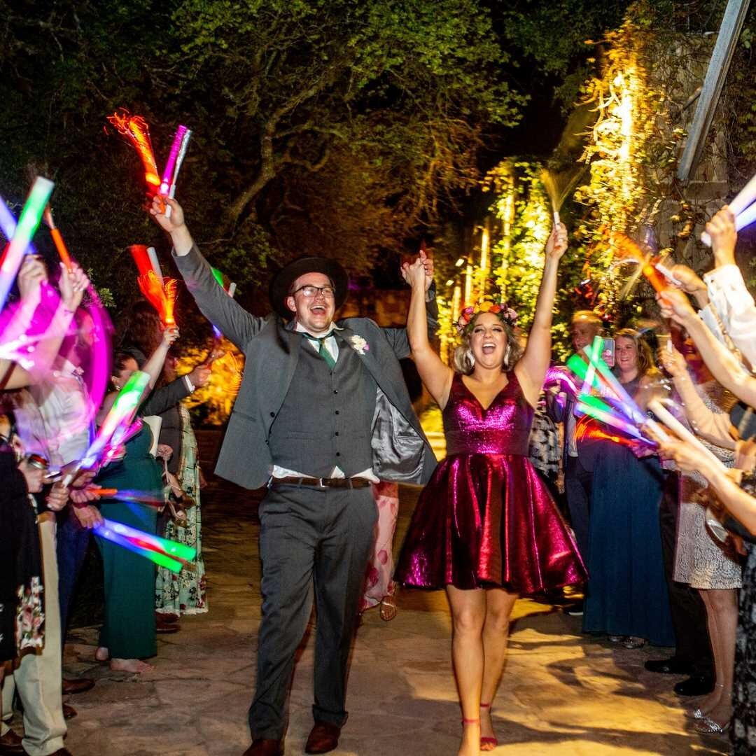 Sparklers are for July 4th! Be creative with your wedding exit - LED, fiber optics, and anything that glows are an excellent way to send off the happy couple. #Happy4thofJuly! 
.
Venue: @wildflowercenter
Photography: @mistymclendonphoto
Hair &amp; Ma