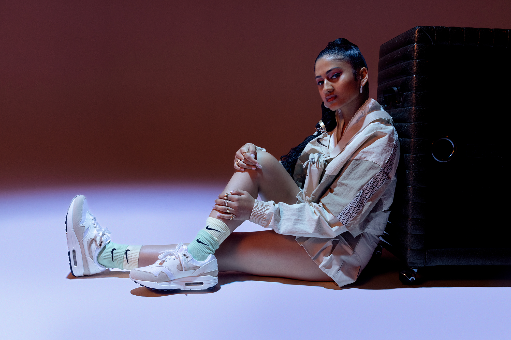 Ashley Mehta leaning on speaker