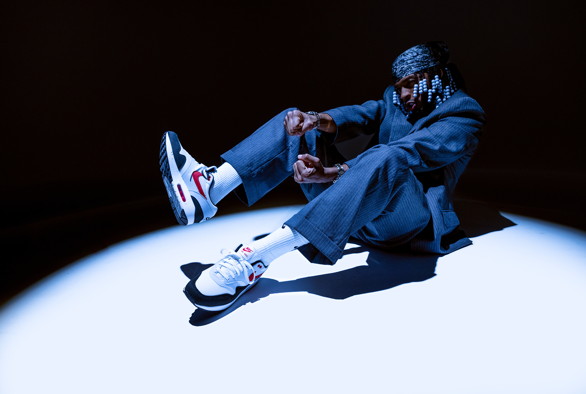 Armani White sitting in spotlight