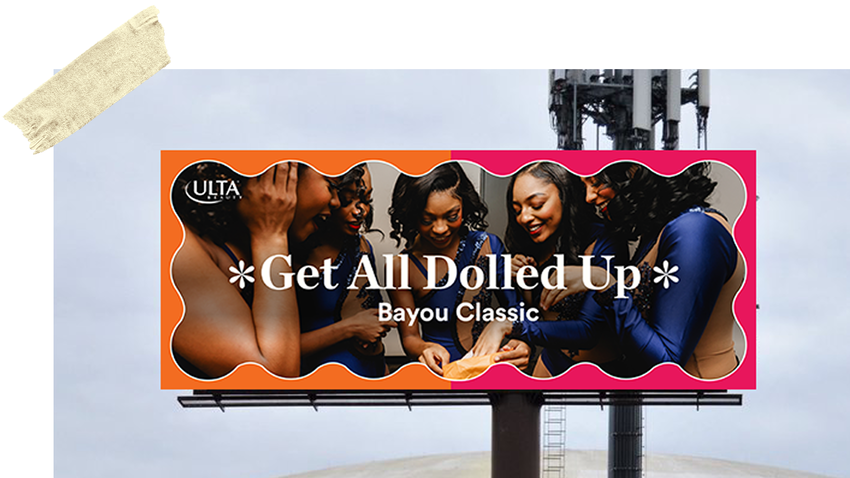 Billboard mockup with the words "Get all dolled up"