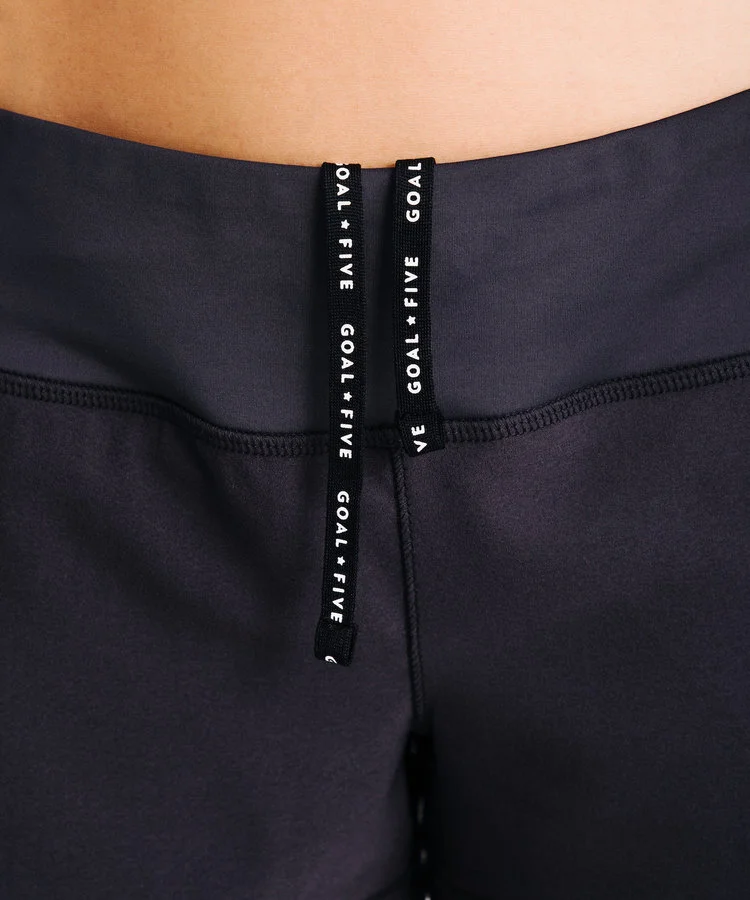 Close up of draw strings on pants