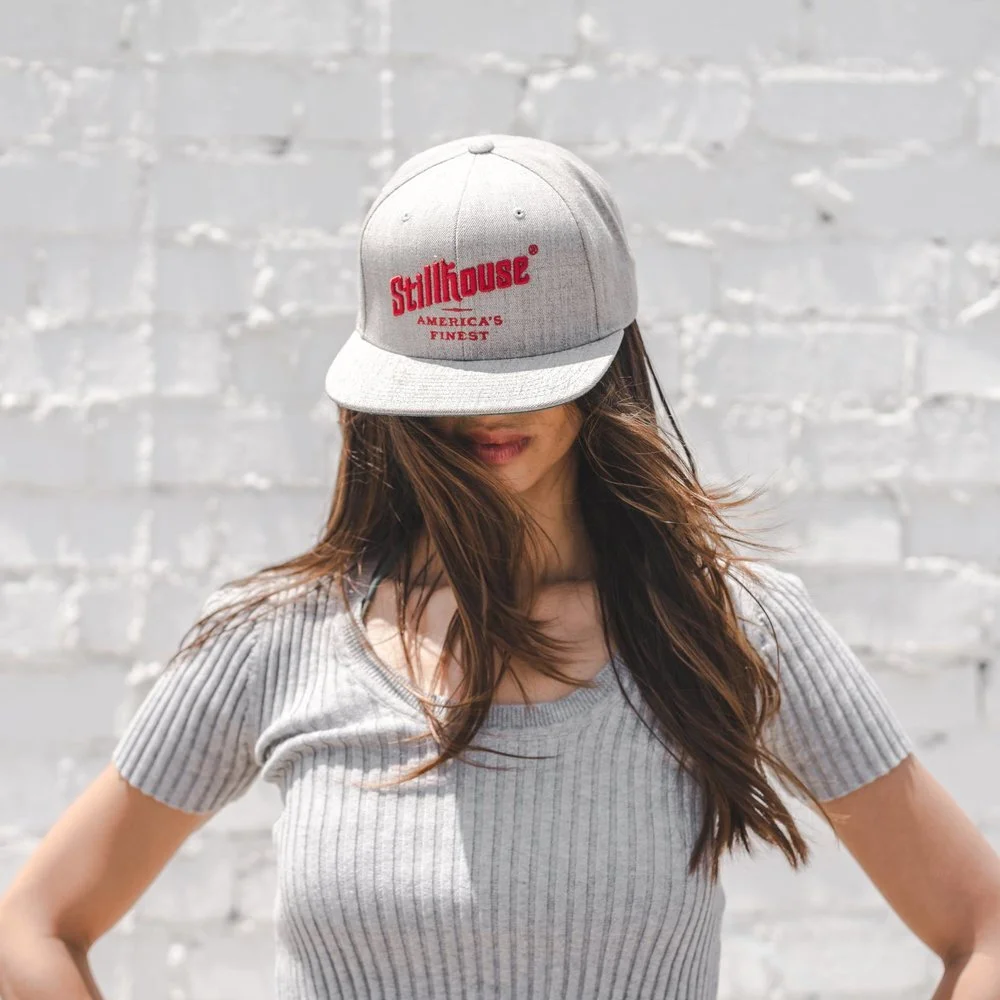 Woman wearing Stillhouse hat